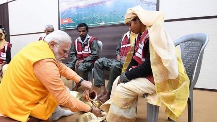 PM-Modi-cleaning-the-feet-of-a-sanitation-worker-696x392