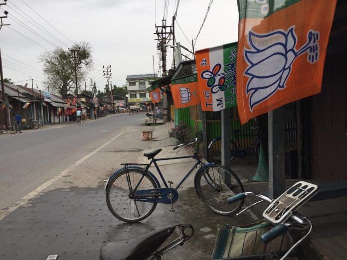 Trinamool Congress and Bharatiya Janata Party flags on display in Cooch Behar