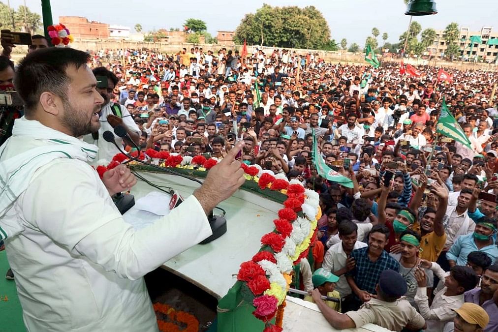 RJD leader Tejashwi Yadav addresses the crowd during an election rally
