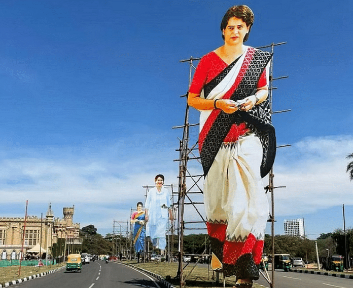 प्रियंका गांधी के चुनावी दौरे से पहले कर्नाटक की सड़क पर उनके कटआउट/Twitter/INC Bagalkote