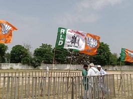 बागपत में योगी आदित्यनाथ की रैली में बीजेपी और आरएलडी के झंडे | फोटो: कृष्ण मुरारी/दिप्रिंट