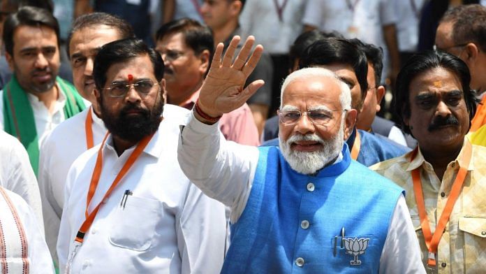 वाराणसी लोकसभा सीट के लिए नामांकन पत्र दाखिल करके बाहर आते प्रधानमंत्री नरेंद्र मोदी, उनके साथ महाराष्ट्र के मुख्यमंत्री एकनाथ शिंदे भी मौजूद | फोटो: सूरज सिंह बिष्ट/दिप्रिंट