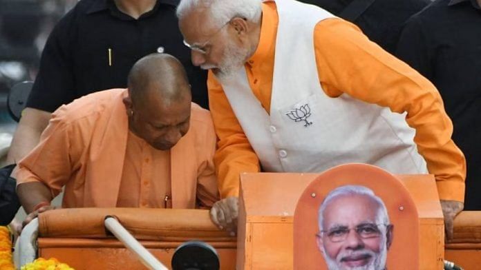 पिछले महीने वाराणसी में एक रोड शो में उत्तर प्रदेश के मुख्यमंत्री योगी आदित्यनाथ के साथ प्रधानमंत्री नरेंद्र मोदी (दाएं) | फोटो: एएनआई