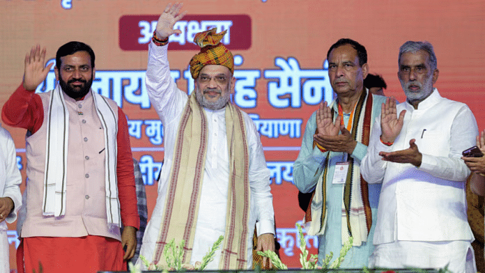 महेंद्रगढ़ में ‘पिछड़ा वर्ग सम्मान सम्मेलन’ के दौरान केंद्रीय गृह मंत्री अमित शाह और हरियाणा के मुख्यमंत्री नायब सिंह सैनी (बाएं) की फाइल फोटो | ANI